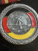 ac259 - VERDIENSTMEDAILLE DER DDR - 1960s model with glass enamel
