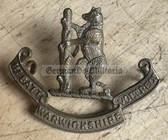 mp018 - original WW1 era British Army cap badge - 1ST BATTALION WARWICKSHIRE VOLUNTEER REGIMENT