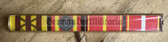 is022 - 4 place paper medal ribbon bar for shirts with Kampforden - NVA or Stasi - General rank or very senior Officer rank