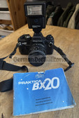 oo133 - East German Praktica BX20 electronic camera with Sigma lens, carry strap and Praktica flash light and user manual - as used by the Grenztruppen Border Guards