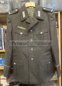 wo131 - NVA Army Conscript Uniform jacket - RD Logistics Gefreiter rank with qualification clasp - size g48
