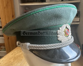 wo167 - c1973 dated East German Volkspolizei Officer ranks VP VoPo BePo police visor hat with transitional cocakde for wear in 1990 - size 55