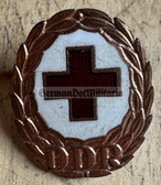 om371 - enamel DRK East German Red Cross honour badge in bronze