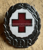 om374 - enamel DRK East German Red Cross honour badge in silver