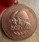 om255 - original national NVA & Soviet Army Waffenbrüderschaft sports competition bronze winner medal with band