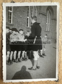 ad351 - HJ Boy with knife and uniform instructing Jungvolk new recruits