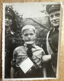 ad356 - HJ boy bandaged up in first aid training - not sure about uniform of the older boys, maybe Red Cross?