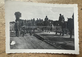 wpc080 - Wehrmacht soldiers with horse drawn artillery passing a column of POW's photo