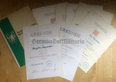 ag003 - large lot of medal award certs for the same woman from Berlin