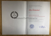 od046 - Verdienstmedaille der DDR - c1979 dated medal award certificate