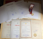 rp036 - Deutsche Post DDR postal service medals and award grouping for the same woman from Blankenburg - includes many promotion certs