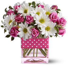 Polka dots and posies, they're the perfect pair. Well, at least in this pretty arrangement they are. Just the right flowers in just the right vase all wrapped up in, you guessed it, just the right ribbon