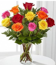 Surprise someone with a Rainbow of a Dozen Lovely Long Stem Roses!  Mixed colors compliment each other for a stunningly beautiful dozen rose bouquet.