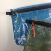 Aquatica on blue pouch, Neon Orange on olive green pouch