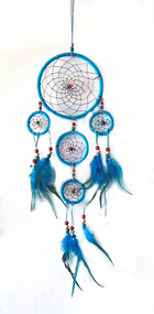 Dream catchers are one of the most fascinating traditions of Native Americans. 

This handmade dream catcher is intended to protect the sleeping individual from negative dreams while letting positive dreams through. The positive dreams will slip through the center of the dream catcher, and glide down the feathers to the sleeping person below. The negative dreams will get caught up in the web, and expire when the first rays of the sun strike them.

Measurements: Top ring is 6.25" diameter, length is approximately 21".
Dimensions will vary slightly due to the handmade nature of this product.