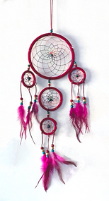 Dream catchers are one of the most fascinating traditions of Native Americans. 

This handmade dream catcher is intended to protect the sleeping individual from negative dreams while letting positive dreams through. The positive dreams will slip through the center of the dream catcher, and glide down the feathers to the sleeping person below. The negative dreams will get caught up in the web, and expire when the first rays of the sun strike them.

Measurements: Top ring is 6.25" diameter, length is approximately 21".
Dimensions will vary slightly due to the handmade nature of this product.