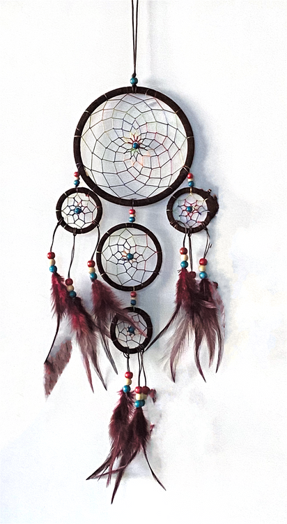 Dream catchers are one of the most fascinating traditions of Native Americans. 

This handmade dream catcher is intended to protect the sleeping individual from negative dreams while letting positive dreams through. The positive dreams will slip through the center of the dream catcher, and glide down the feathers to the sleeping person below. The negative dreams will get caught up in the web, and expire when the first rays of the sun strike them.

Measurements: Top ring is 6.25" diameter, length is approximately 21".
Dimensions will vary slightly due to the handmade nature of this product.