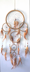 Dream catchers are one of the most fascinating traditions of Native Americans. 

This handmade dream catcher is intended to protect the sleeping individual from negative dreams while letting positive dreams through. The positive dreams will slip through the center of the dream catcher, and glide down the feathers to the sleeping person below. The negative dreams will get caught up in the web, and expire when the first rays of the sun strike them.

Measurements: Top ring is 11" diameter, length is approximately 32".
Dimensions will vary slightly due to the handmade nature of this product.