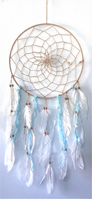 Dream catchers are one of the most fascinating traditions of Native Americans. 

This handmade dream catcher is intended to protect the sleeping individual from negative dreams while letting positive dreams through. The positive dreams will slip through the center of the dream catcher, and glide down the feathers to the sleeping person below. The negative dreams will get caught up in the web, and expire when the first rays of the sun strike them.

Measurements: Top ring is 13" diameter, length is approximately 29".
Dimensions will vary slightly due to the handmade nature of this product.