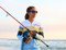 Lightweight quick-dry fishing hoodie being worn by a women in the Australian sun - ARPANSA certified.