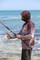 Lightweight quick-dry fishing hoodie being worn in the Australian sun - ARPANSA certified.
