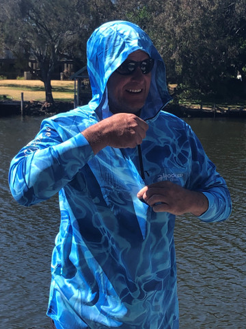 Lightweight quick-dry adventure hoodie being worn in the Australian sun - ARPANSA certified.