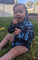 Baby wearing a Hooked Gear Coral print fishing hoodie, playing outside in the Garden 
