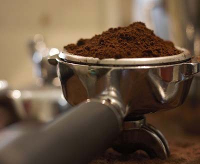 Ground coffee beans in a portafilter