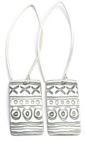 This earring is made of sterling silver.  The pendent measures around 1/2" x 5/8".  It has a disk on the back with "Protect this Woman" stamped it.  The ear wire is about 1 1/2" long.  Inspired by African Mud Cloth.  Really nice!