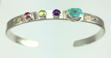 A PROTECT THIS WOMAN BRACELET, TURQUIOSE ON SALE