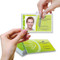 A photograph of installing a self-laminating cover on an employee ID card.