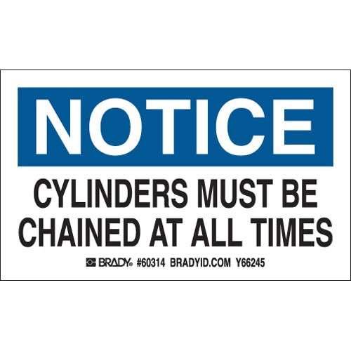 Drawing of blue, black, and white notice sign with text "cylinders must be chained at all times".