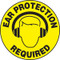 An image of a Slip-Gard™ Floor Sign.  This yellow sign has "EAR PROTECTION REQUIRED" in black lettering around the circumference of the sign with a graphic of a face with ear protection in the center.