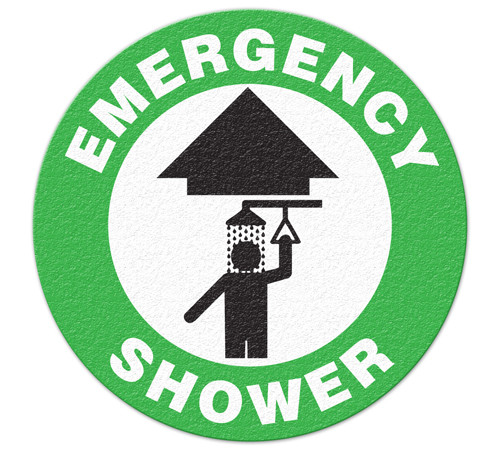 A green and white photograph of a 05223 anti-slip safety floor markers, reading emergency shower with arrow graphic.