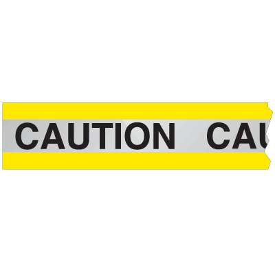 A yellow and silver photograph of a 05361 reflective barricade tape, reading caution.
