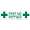 A green and white photograph of a 03416 first aid supplies cabinet label with cross graphics.