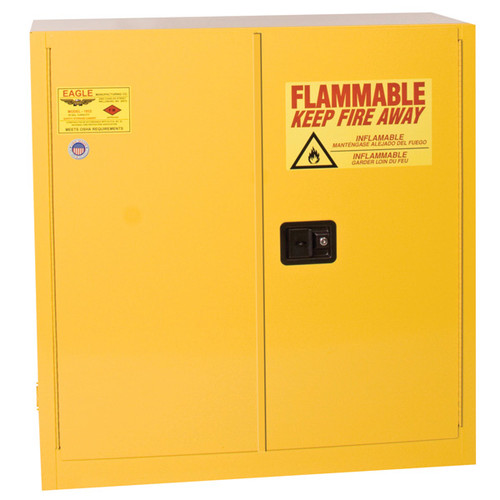 A photograph of a yellow standard 02006 eagle flammable liquid safety cabinets, with 30 gallon capacity and both doors closed.