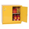 A photograph of a yellow 02009 eagle under counter flammable liquid safety cabinets, with 22 gallon capacity and one door open.