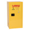 A photograph of a yellow standard 02010 eagle space saver flammable liquid safety cabinets, with 16 gallon capacity and door closed.