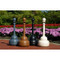 Photograph of gray, brown, black, and beige cigarette receptacles installed outdoors.