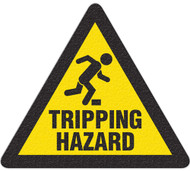 A photograph of black and yellow 05252 anti-slip safety floor markers, reading tripping hazard with graphic.