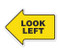 A photograph of yellow and black 05259 anti-slip safety floor markers, reading look left with arrow shape.