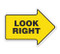 A photograph of yellow and black 05260 anti-slip safety floor markers, reading look right with arrow shape.