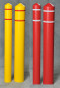 A photograph of four 02285 eagle smooth bollard post sleeves with reflective striping in both red and yellow, and differing diameters.