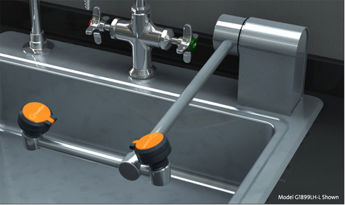 A photo of a Guardian G1899 Eyewash, Deck Mounted, AutoFlow™ Swing-Down, All-Stainless Steel mounted on the rear right side of sink (sink not included)