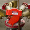 A photograph of a red 07142 zing adjustable gate valve lockout device installed on valve in open position, with 1" to 6.5" diameter.