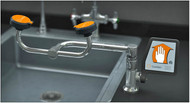 A photograph of a Guardian G1775 Eyewash with right-hand mounting installed to the right of an existing sink (sink and counter are not included).