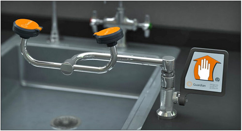 A photograph of a Guardian G1775 Eyewash with right-hand mounting installed to the right of an existing sink (sink and counter are not included).