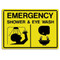 A photograph of a yellow and black 04030 emergency shower and eyewash sign with graphics.