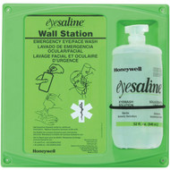 One bottle Honeywell eyewash station with a green backer/mounting board w/ usage instructions and a 32 ounce bottle of Eyesaline® mounted on it.